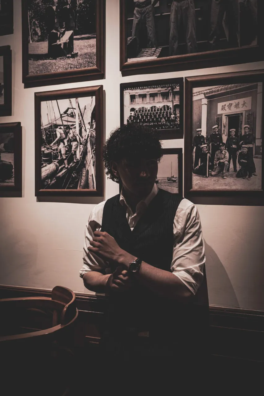 Portrait of Shan A. Hashmi in a heritage photo gallery